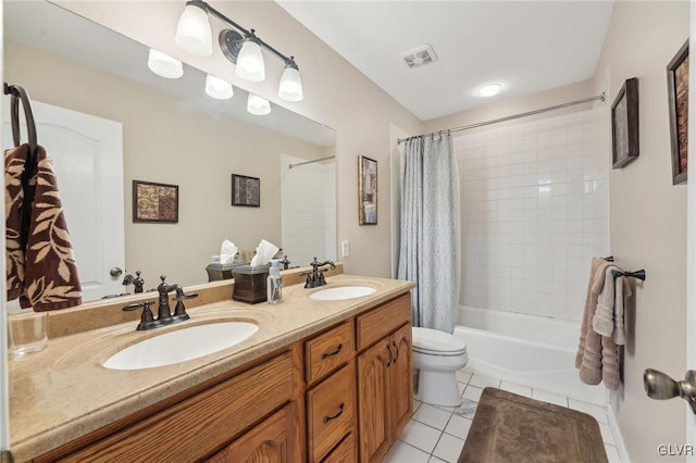 full bath featuring tile patterned floors, visible vents, shower / tub combo, and a sink