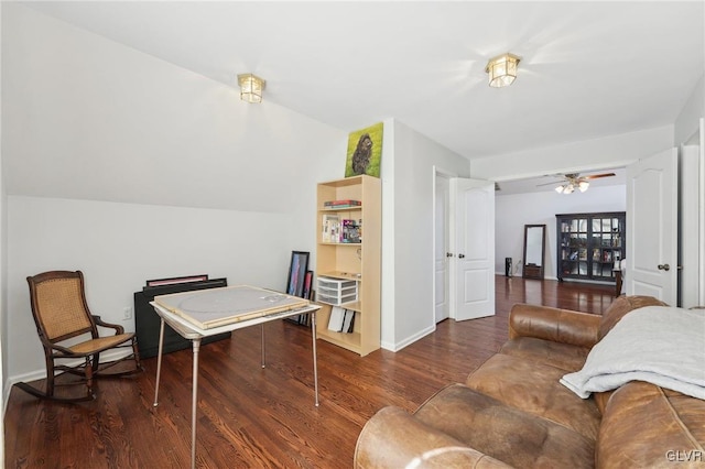 interior space featuring baseboards, wood finished floors, and a ceiling fan