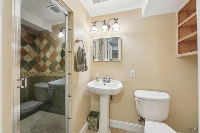 full bathroom featuring visible vents, a stall shower, toilet, and baseboards