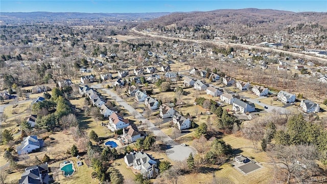 birds eye view of property with a mountain view and a residential view