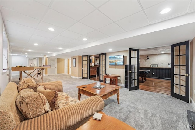 living area with baseboards, carpet, recessed lighting, french doors, and a paneled ceiling