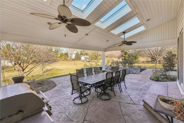 view of patio / terrace with outdoor dining area and a ceiling fan