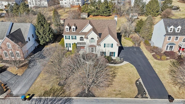 birds eye view of property with a residential view