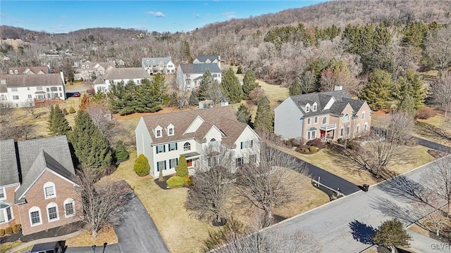 birds eye view of property featuring a residential view and a view of trees