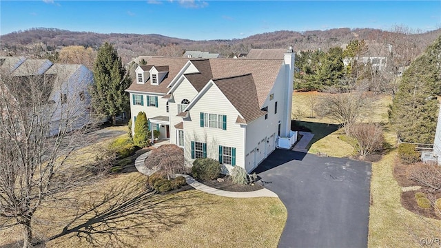 birds eye view of property with a mountain view