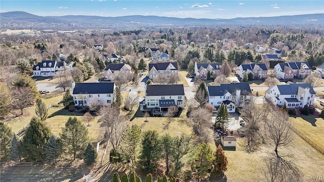 drone / aerial view with a residential view and a mountain view