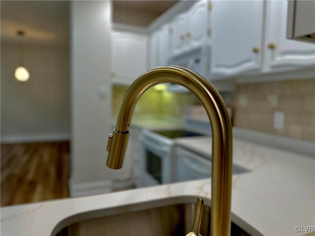 details with white cabinetry and light countertops