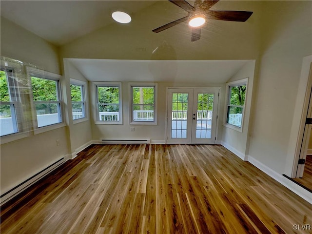 unfurnished sunroom featuring ceiling fan, lofted ceiling, french doors, and a baseboard radiator