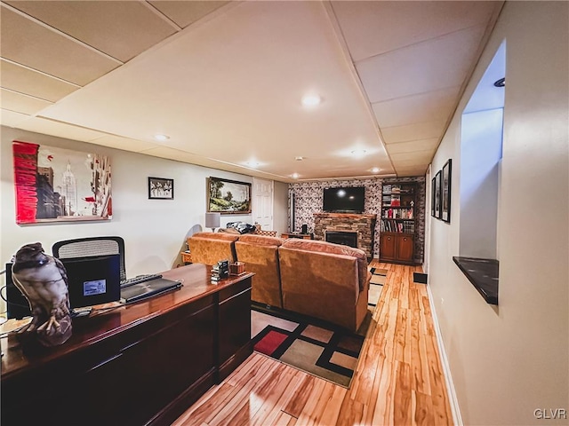 interior space with a fireplace and light wood-style floors