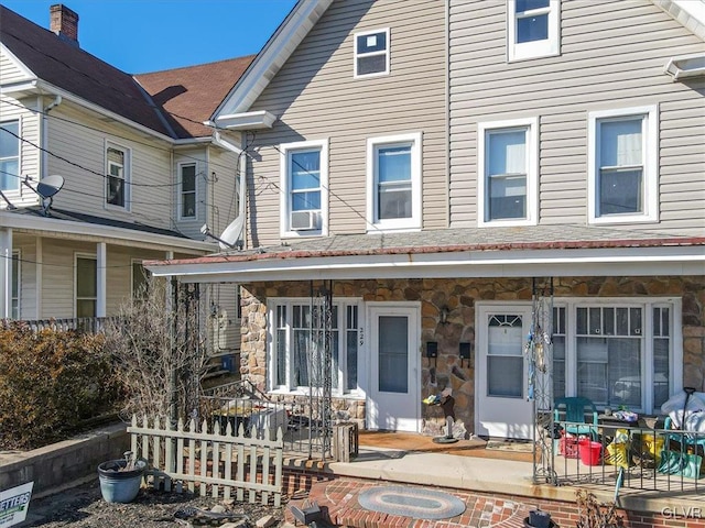 exterior space featuring cooling unit and covered porch