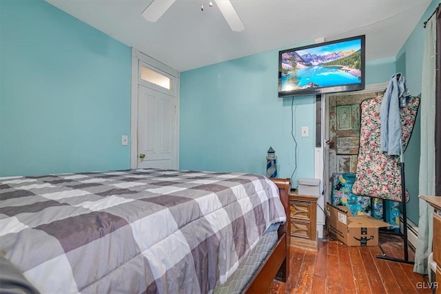 bedroom with ceiling fan and wood finished floors