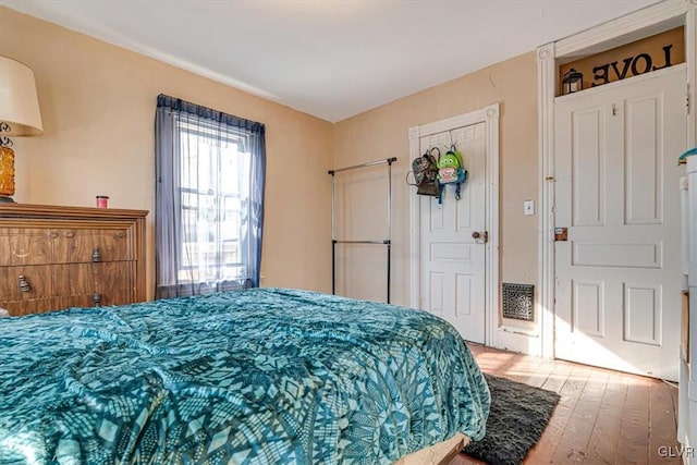 bedroom with wood finished floors