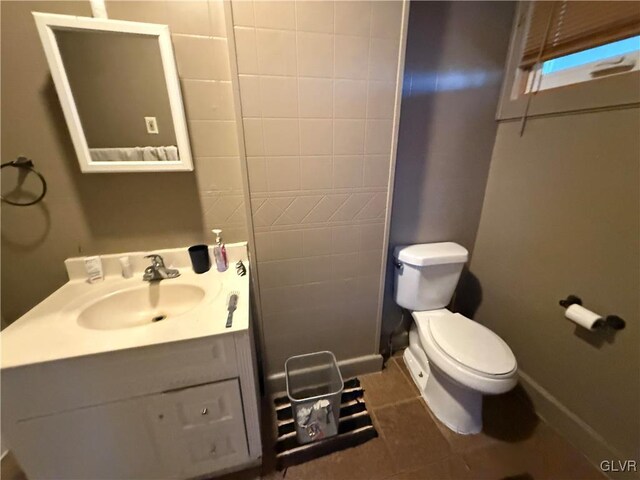 25 S Locust St, Easton, PA 18042 - bathroom with tile patterned floors, toilet, vanity, and baseboards