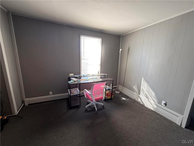 office area featuring a baseboard heating unit and baseboards