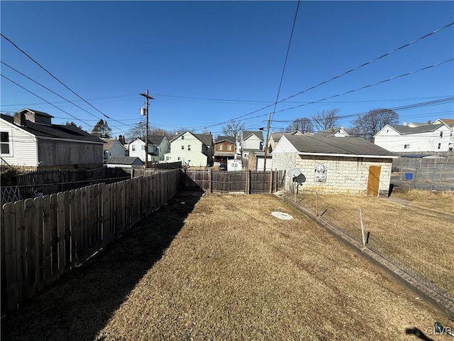 view of yard featuring a residential view and fence private yard