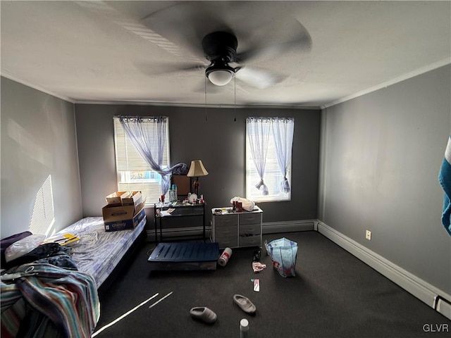 bedroom featuring ceiling fan, multiple windows, baseboards, and ornamental molding