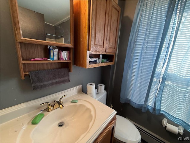 bathroom with toilet and vanity