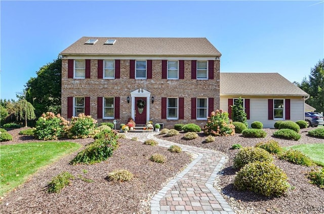 colonial house with brick siding