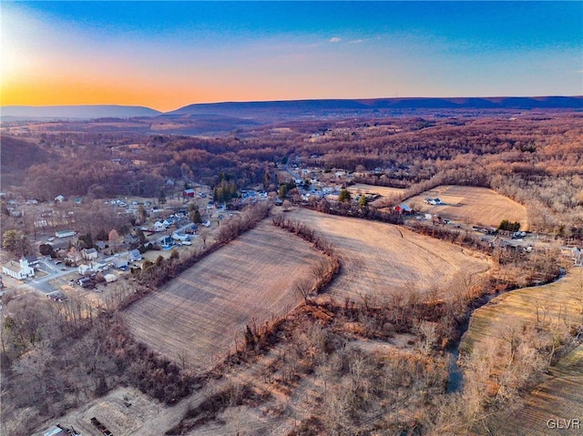 aerial view at dusk with a mountain view