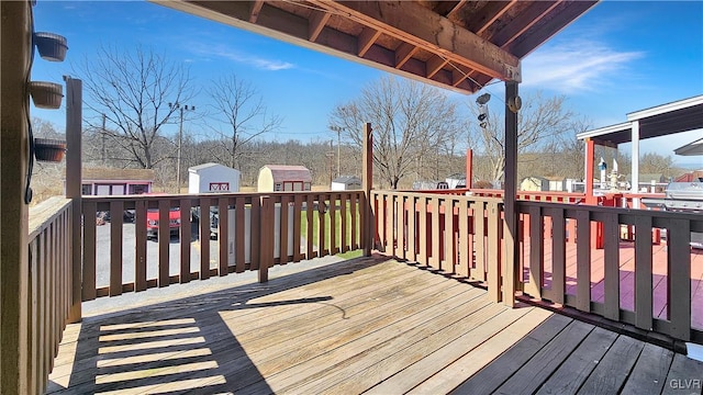 wooden deck with an outbuilding