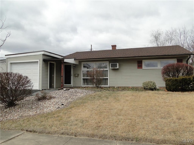 single story home with a front yard, an AC wall unit, a garage, and a shingled roof