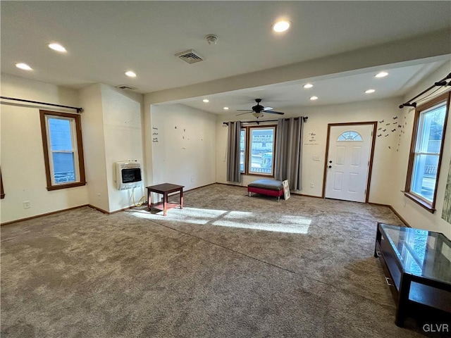 interior space with heating unit, recessed lighting, visible vents, and a wealth of natural light