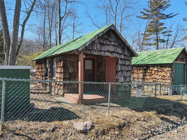 view of outdoor structure with an outdoor structure and fence