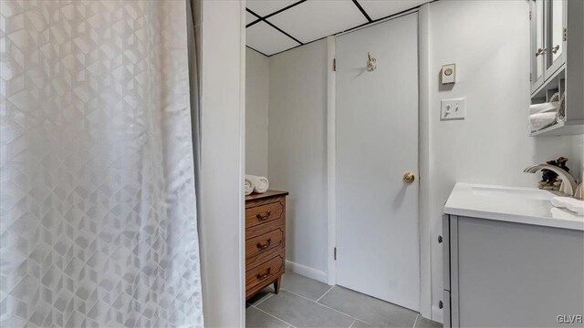 bathroom featuring tile patterned floors, a shower with shower curtain, and vanity