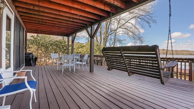 deck with outdoor dining area