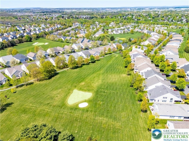 birds eye view of property featuring a residential view and view of golf course