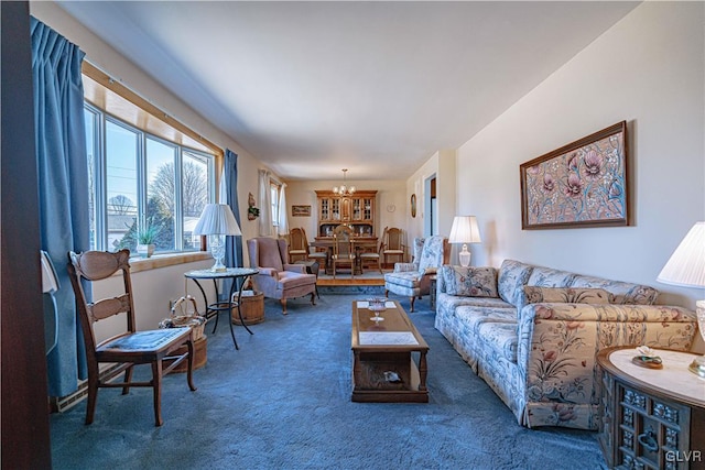 carpeted living area with a notable chandelier