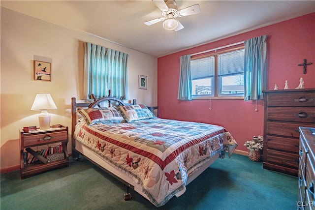 bedroom featuring multiple windows, a ceiling fan, baseboards, and carpet floors