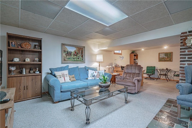 living room featuring visible vents, a paneled ceiling, and carpet floors