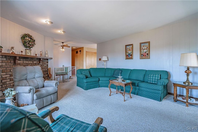 carpeted living room with ceiling fan