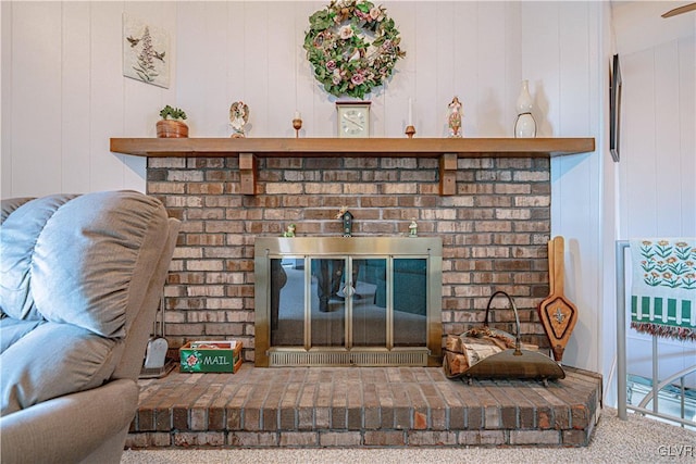 room details with carpet flooring and a fireplace