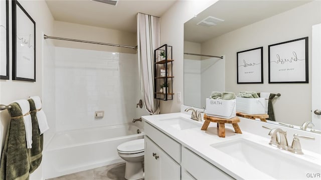 full bath featuring a sink, visible vents, toilet, and double vanity