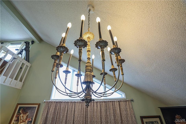 details featuring beam ceiling and a textured ceiling