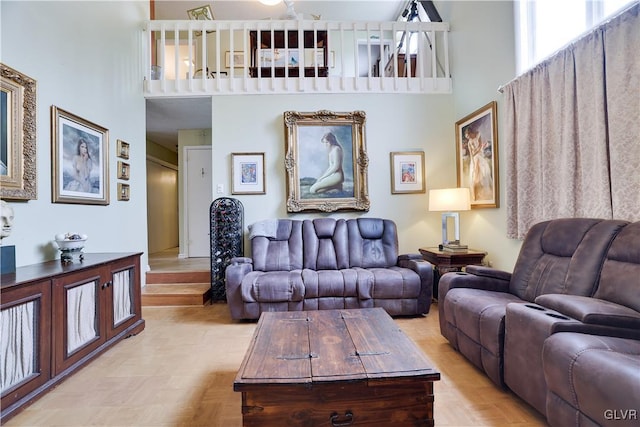 living area with a high ceiling