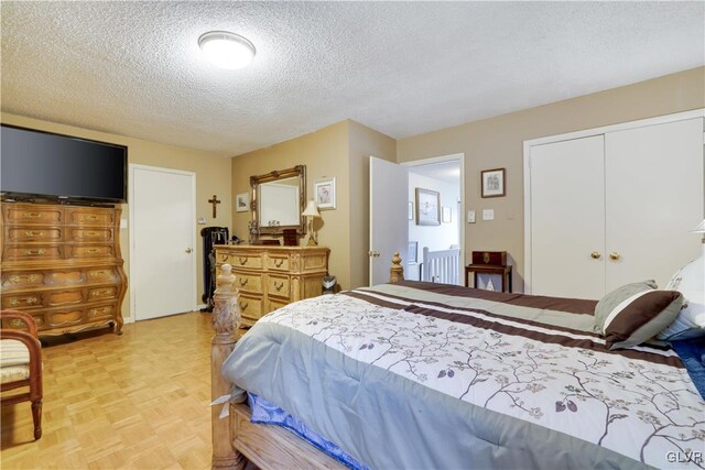 bedroom featuring a closet and a textured ceiling