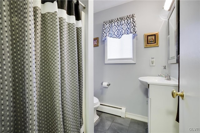 full bathroom featuring toilet, a baseboard heating unit, tile patterned flooring, baseboards, and vanity