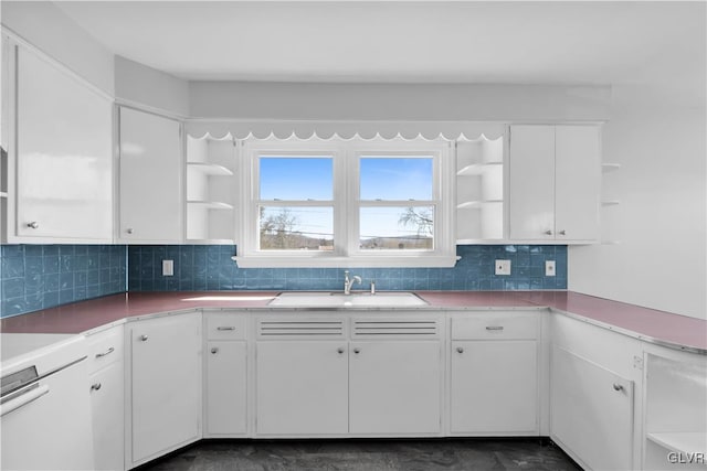 kitchen with open shelves, white cabinets, and a sink