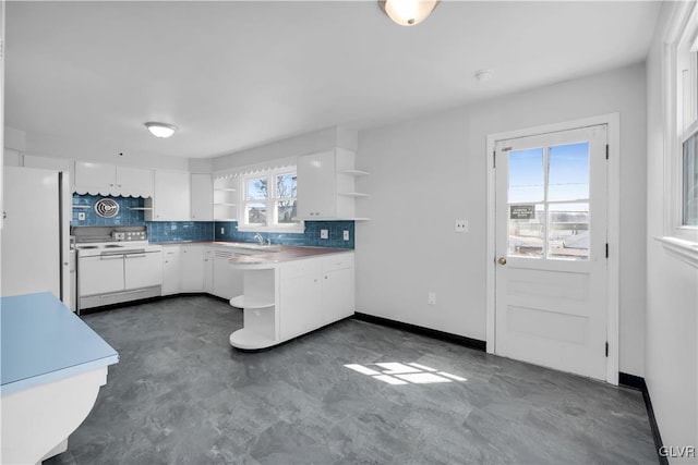 kitchen with open shelves, a sink, backsplash, white cabinetry, and white appliances