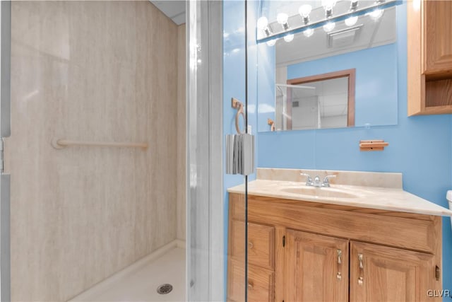 bathroom featuring vanity and a stall shower