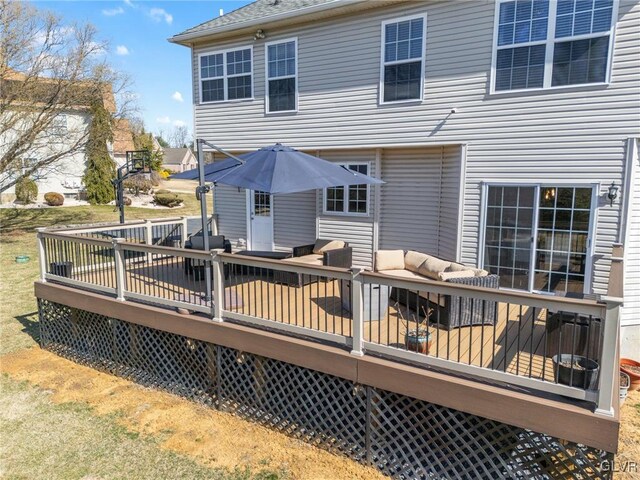 rear view of property featuring a deck