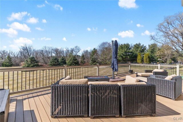 wooden deck featuring an outdoor hangout area