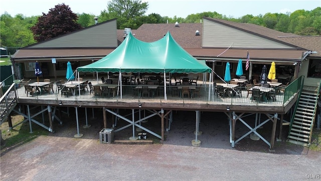 view of dock with a wooden deck and stairs