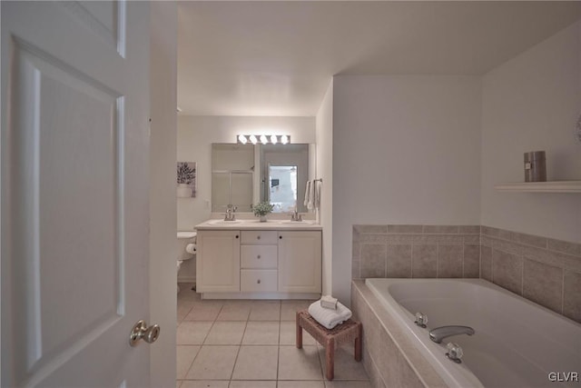 full bathroom with tile patterned floors, a bath, double vanity, and a sink