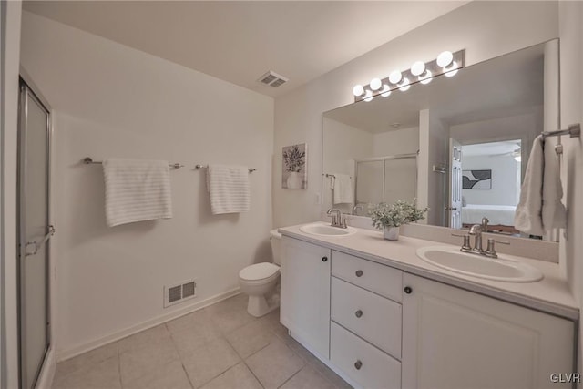 bathroom with a sink, visible vents, and a stall shower