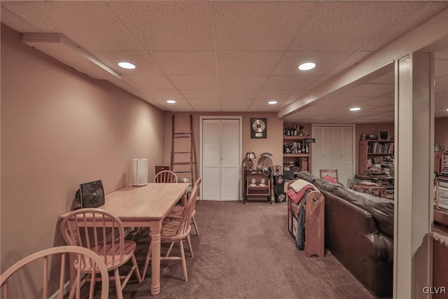 carpeted dining space featuring recessed lighting