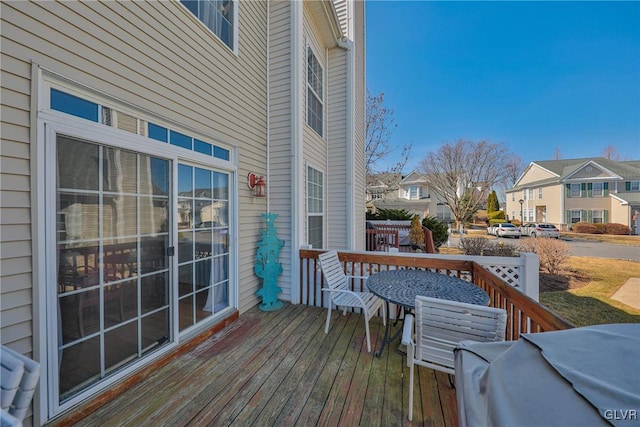 wooden deck with a residential view